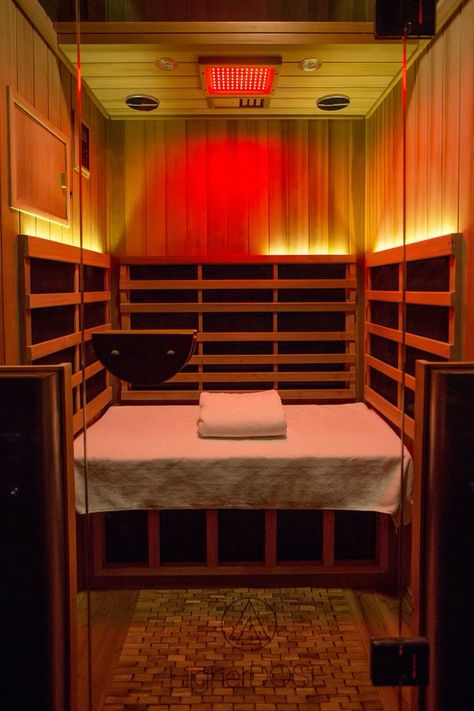 Infrared sauna interior with warm red and amber lighting